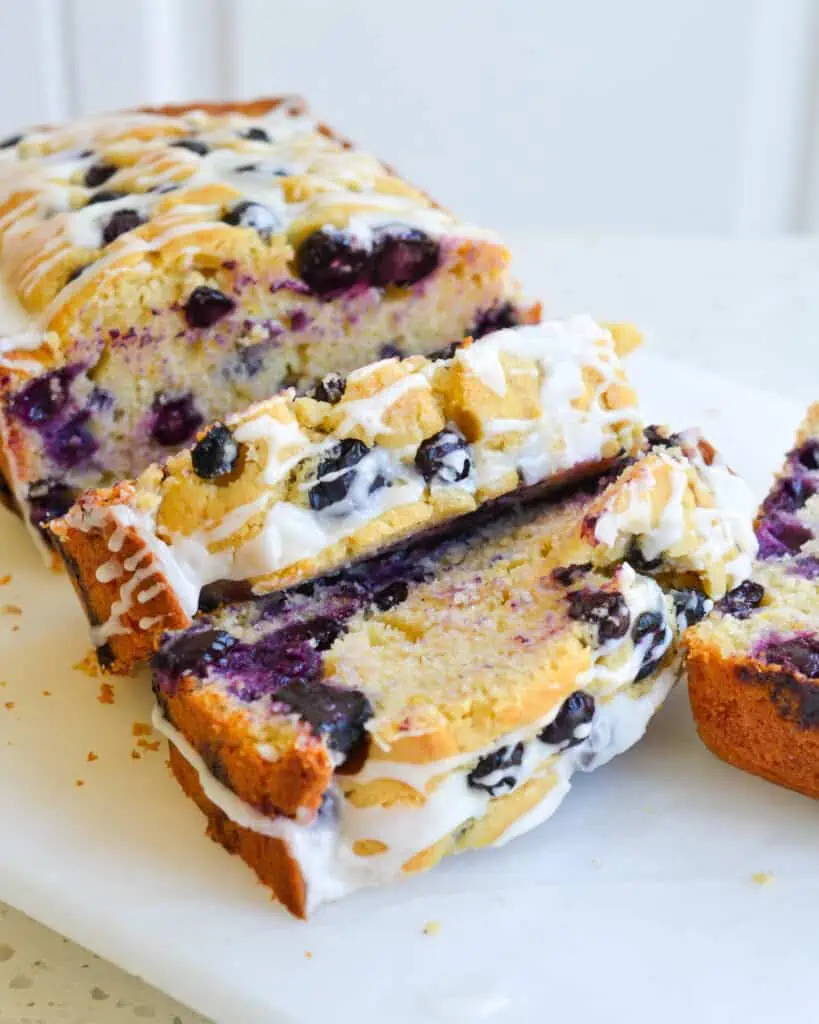 This sweet Blueberry Lemon Bread is filled with plump blueberries and topped with a zesty lemon icing. It's perfect for a light breakfast or as a sweet treat.