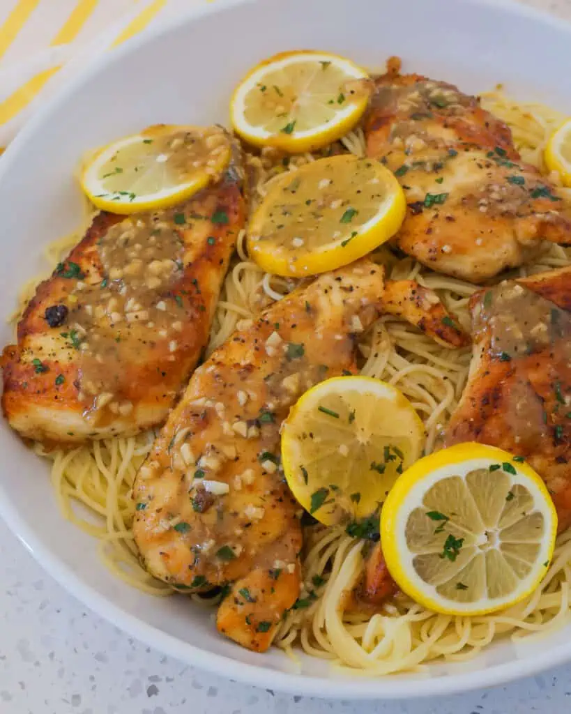 Lemon Pepper Chicken is an easy weeknight meal that comes together quickly in one skillet.  It combines lemon pepper breaded chicken with garlic and lemons in a light lemon sauce made with a splash of real lemon juice.