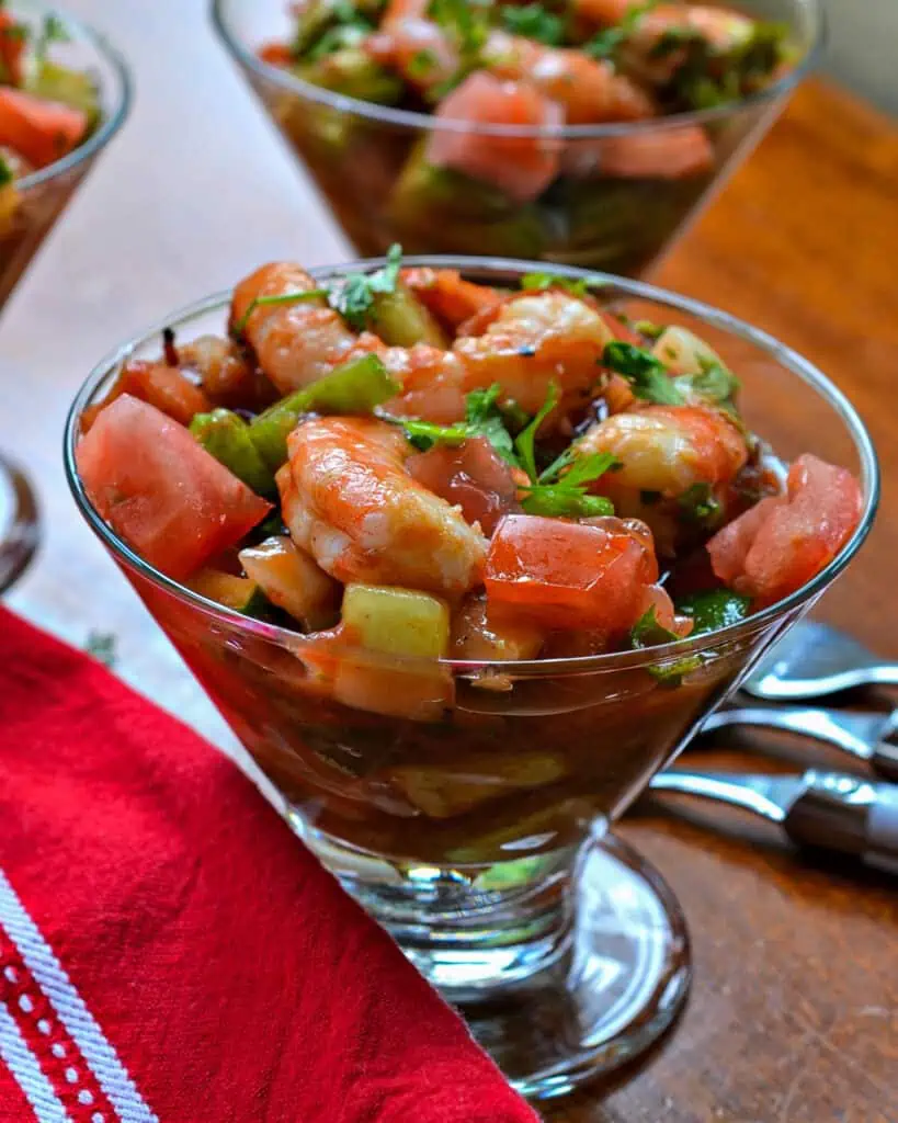 Mexican shrimp cocktail is a salad with crisp veggies like cucumbers, onions, and creamy avocado, sun-ripened tomatoes, and fresh, zesty jalapenos. Top it with a slightly spicy tomato sauce, and your taste buds will be dancing to the Macarena. 