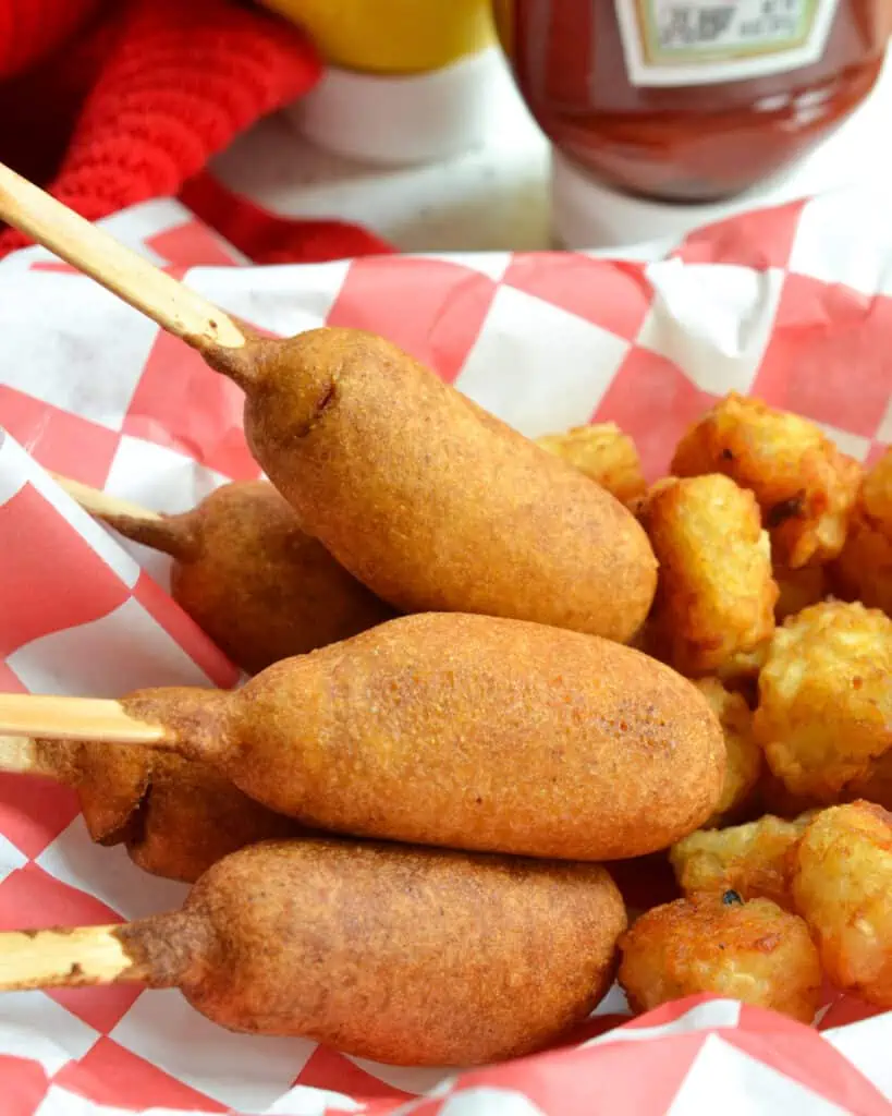 Now you too can make better than fair Corn Dog bites right in your own kitchen.  These delicious dogs are easy, quick to come together, and they make great snacks.