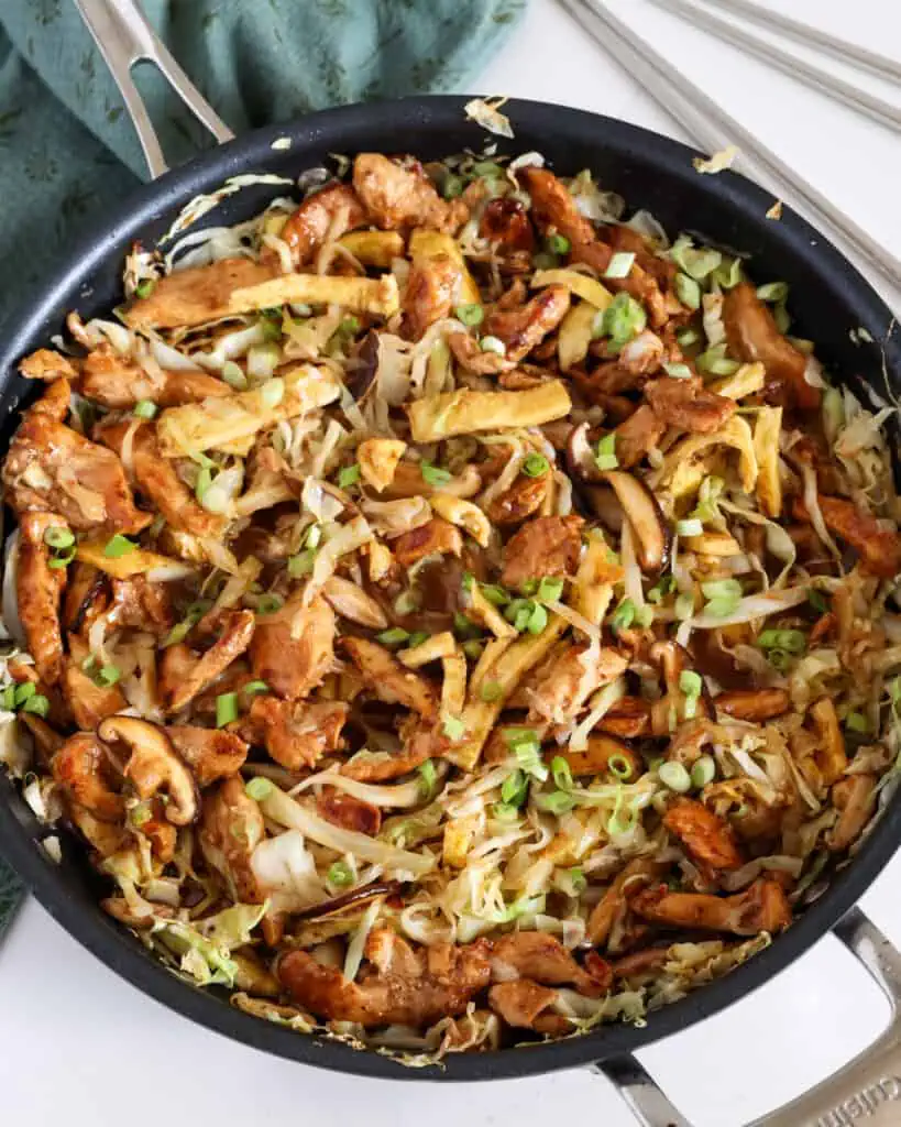 Moo Shu Chicken combines tender marinated chicken stir-fried with cabbage, mushrooms, and eggs in a savory sauce with the flavors of garlic and ginger.