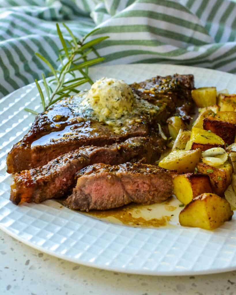 Cut New York Strip Steak with fried potatoes. 