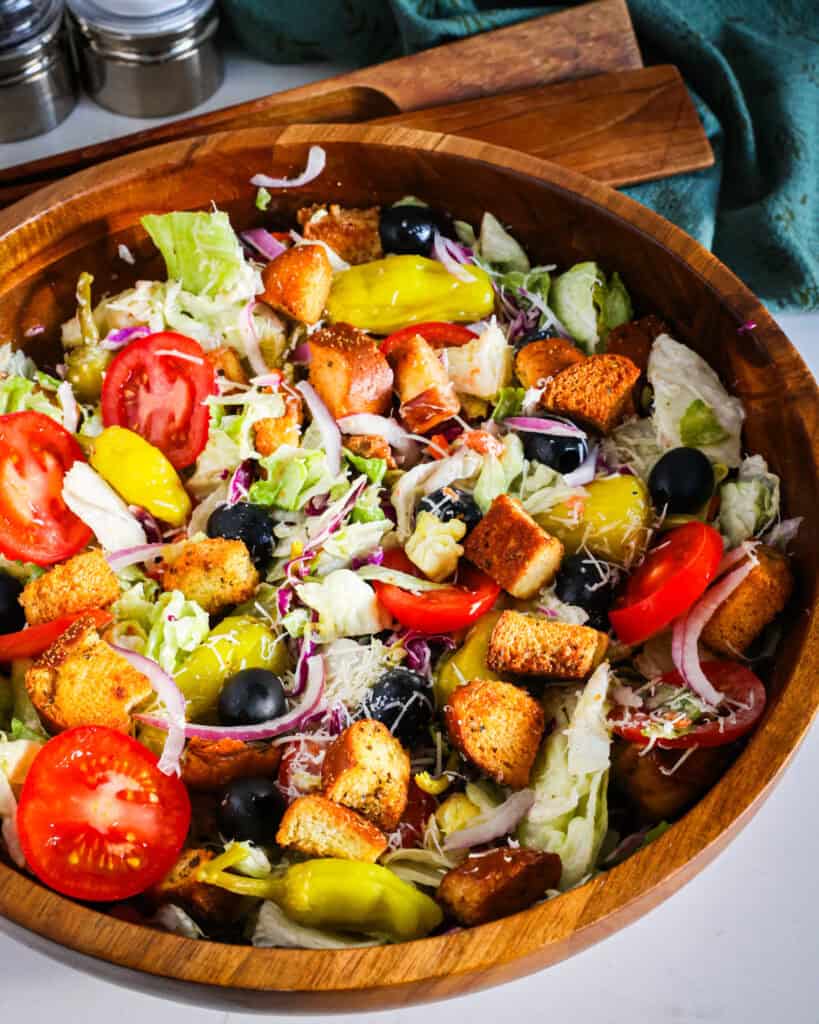 Learn how to recreate the famous Olive Garden salad at home, complete with their signature dressing. 