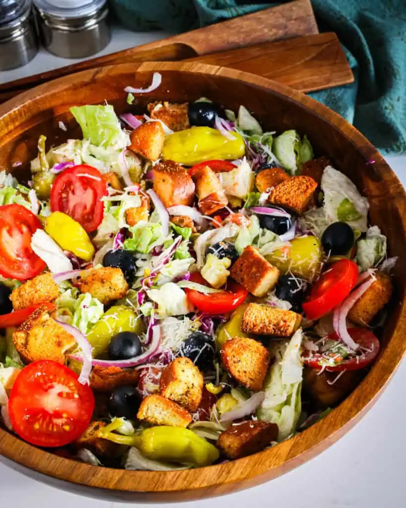 Learn how to recreate the famous Olive Garden salad at home, complete with their signature dressing.