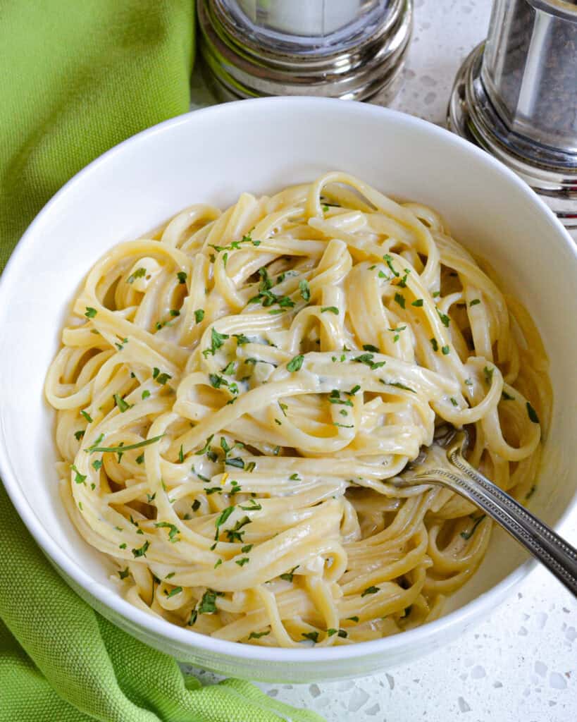 A delectable creamy garlic Parmesan Pasta that is made easy in one pot.  The perfect side dish for grilled chicken, roasted pork tenderloin or chicken spedini.