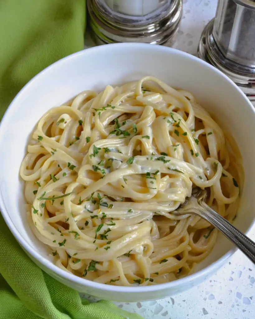 A delectable creamy garlic Parmesan Pasta that is made easy in one pot.  The perfect side dish for grilled chicken, roasted pork tenderloin or chicken spedini.