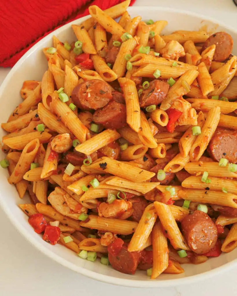 Easy Louisiana-style Pastalaya combines Andouille smoked sausage, chicken, bell peppers, celery, onions, and garlic in a Cajun tomato sauce over pasta. 