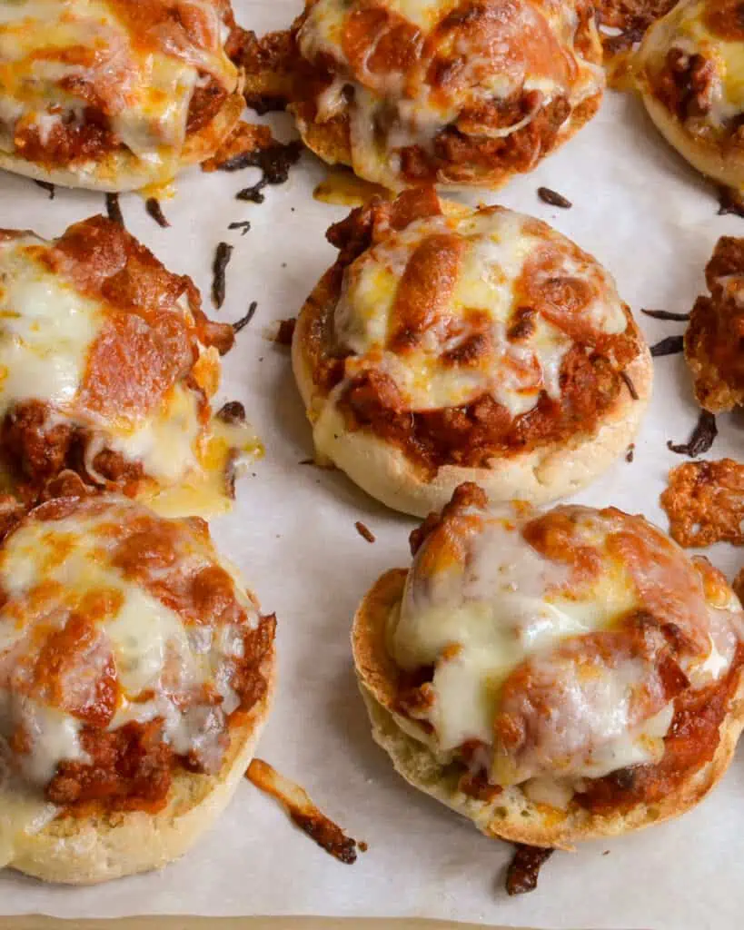 These delicious and easy Pizza Burgers are made with ground beef, onions, garlic, marinara, mushrooms, pepperoni, and melted mozzarella on toasted English muffins. 