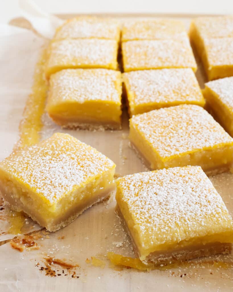 These tangy lemon bars are the ultimate treat. They have a simple shortbread crust, fresh lemon curd, and a dusting of powdered sugar.