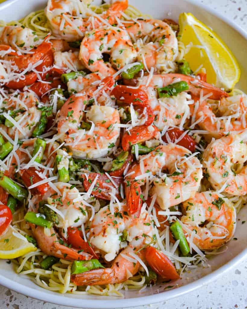 A simple, elegant and easy shrimp scampi recipe with a lemon garlic butter sauce. It is traditionally served over angel hair pasta or thin spaghetti drizzled with scampi sauce.