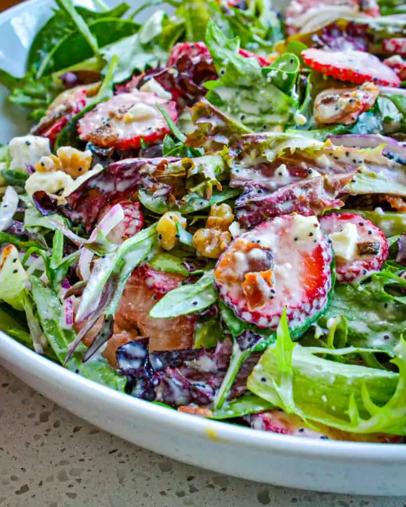 Sweet and crunchy Strawberry Spinach Salad with poppy seed dressing is the perfect spring and summer salad. 