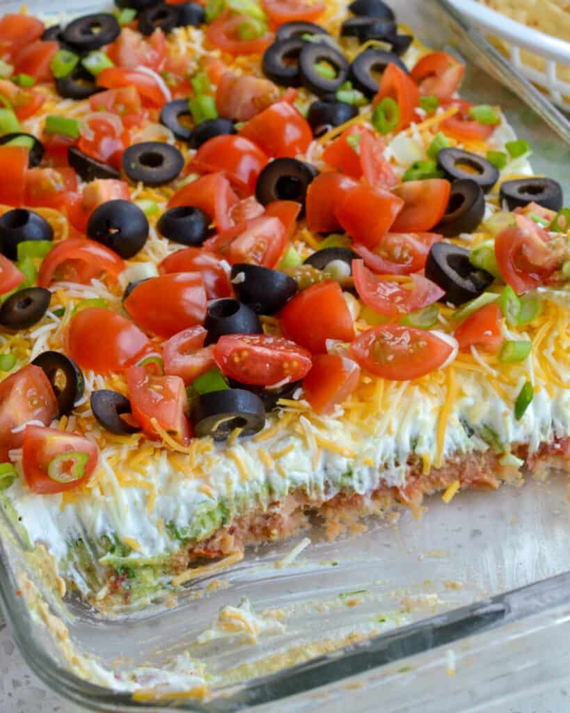 This easy 7 Layer Dip is always a huge hit at parties, potlucks, gamedays, and reunions. 