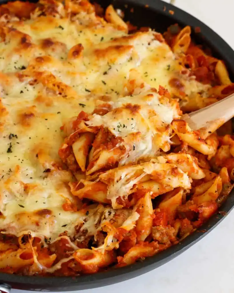 This is a super easy casserole the whole family can enjoy with mostaccioli pasta (penne lisce) and meat sauce, all covered in a blanket of delicious Italian cheeses and baked to perfection.