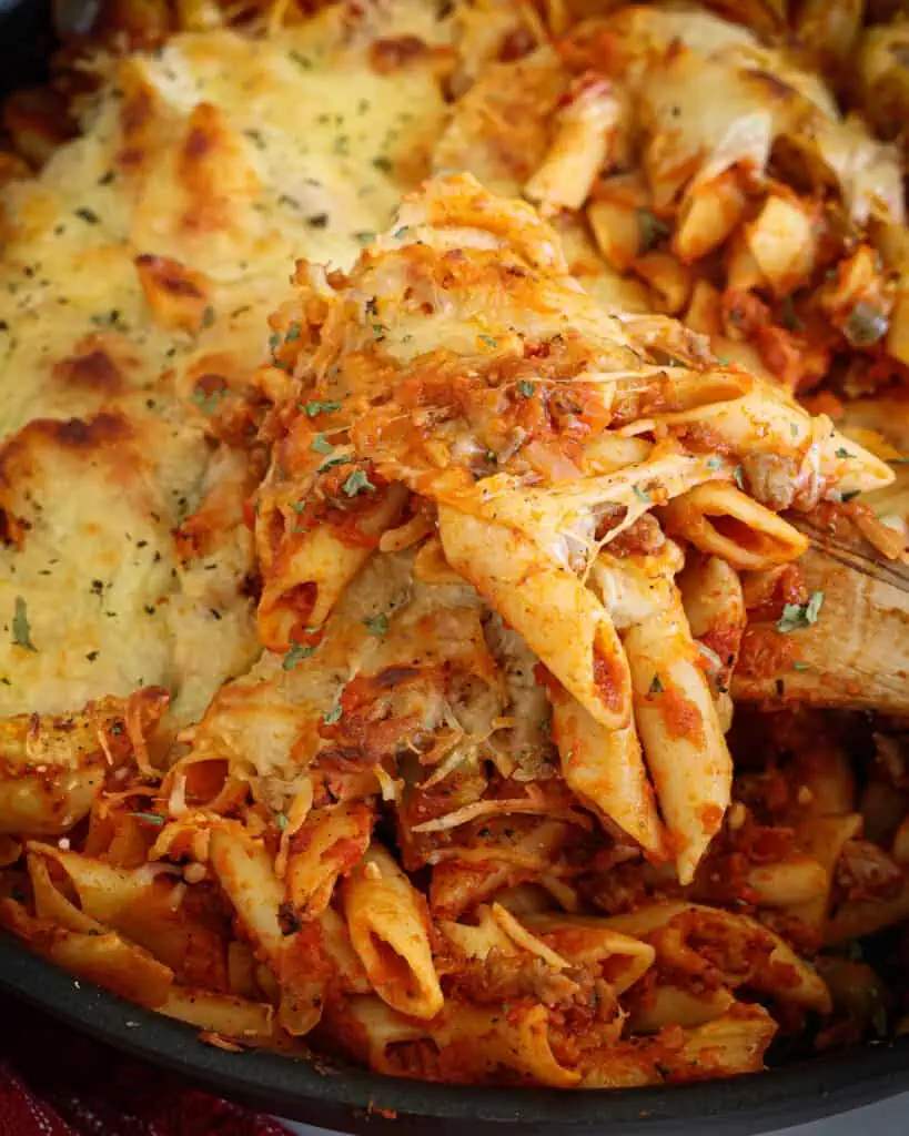 This delicious baked mostaccioli contains layers of fresh Italian sausage, sweet onions, minced garlic, and marinara. It is then topped with Parmesan and mozzarella cheese. 