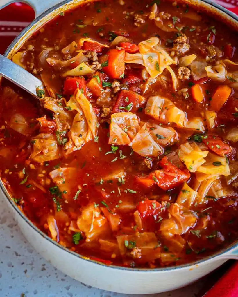 This tasty Cabbage Soup Recipe is made with ground beef, ground pork sausage, cabbage, onions, garlic, carrots, and fire-roasted tomatoes in a delicious beefy tomato broth.