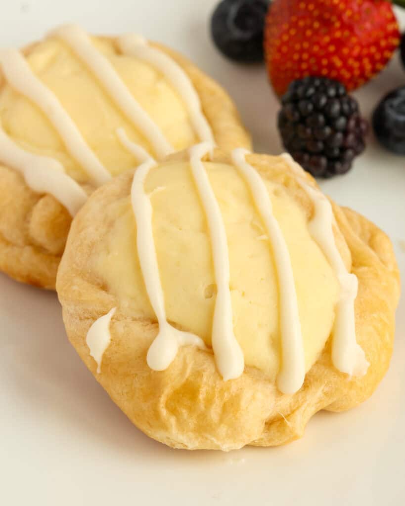 These delectable easy cream Cheese Danish are made easy with ready-made crescent roll dough, a five-ingredient cream cheese filling, and a two-minute glaze.
