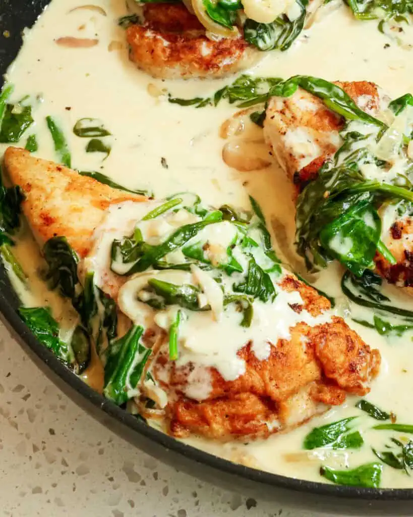 This one-skillet recipe brings lightly breaded golden brown chicken breasts, shallots, garlic, and spinach together in a rich, creamy white wine sauce sprinkled with Parmesan