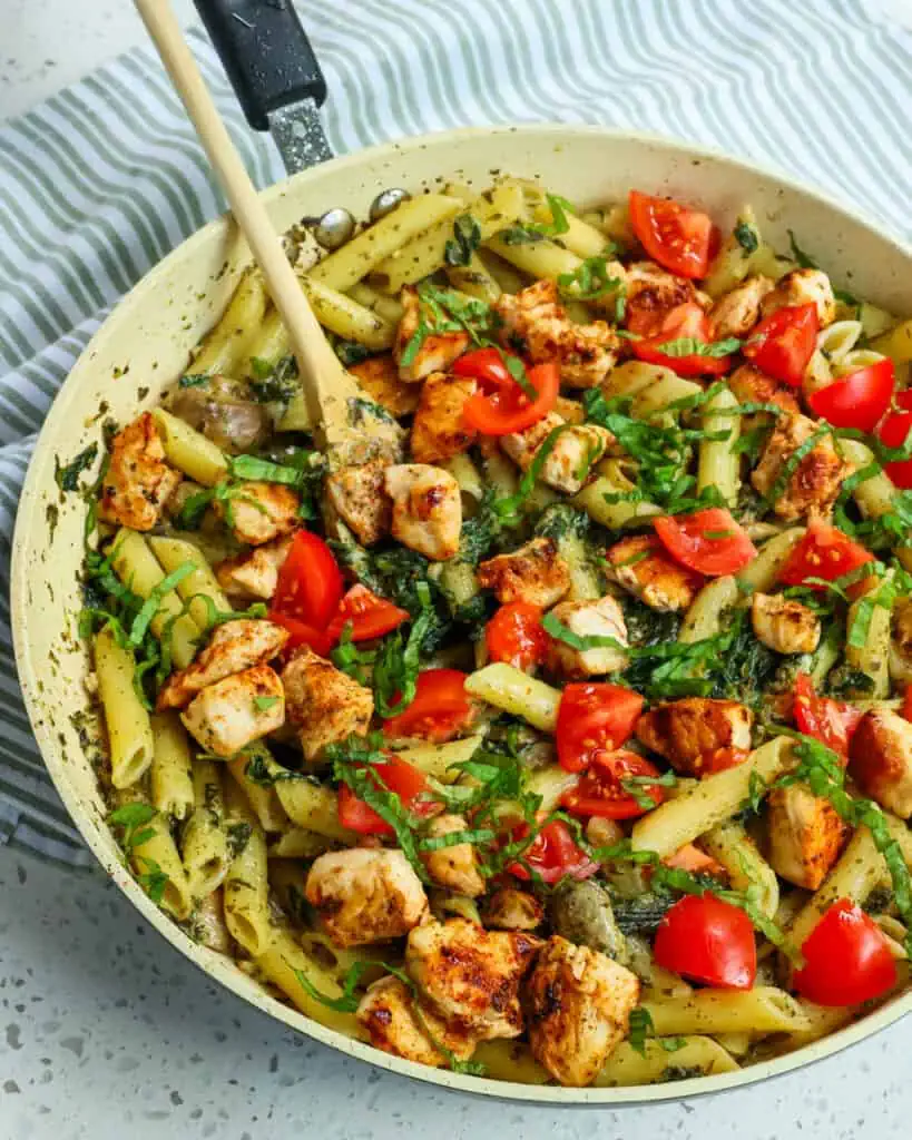 A deliciously easy and flavor-packed Chicken Pesto Pasta made with chicken breasts, mushrooms, spinach, and penne pasta all drenched in creamy pesto sauce.