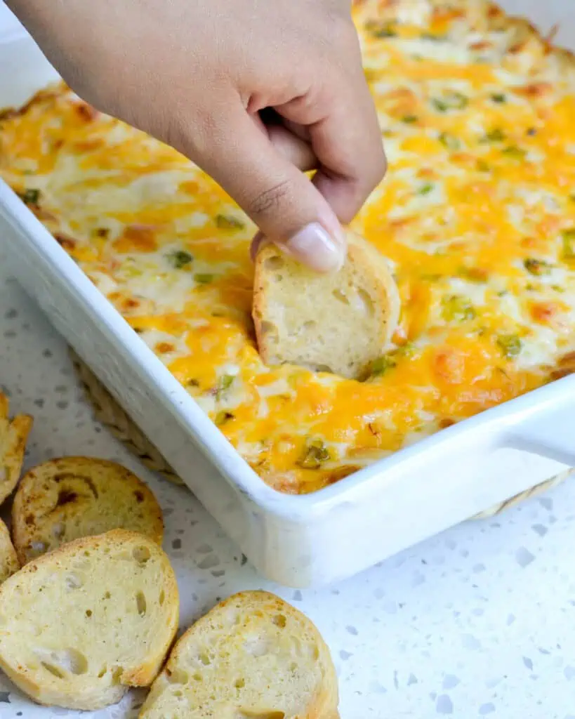 An easy-to-make hot crab dip filled with creamy cheese, cooked lump crab meat, and a perfect blend of spices. All baked to golden brown and served warm.  Simple yet elegant enough for Christmas and New Year's Eve. 