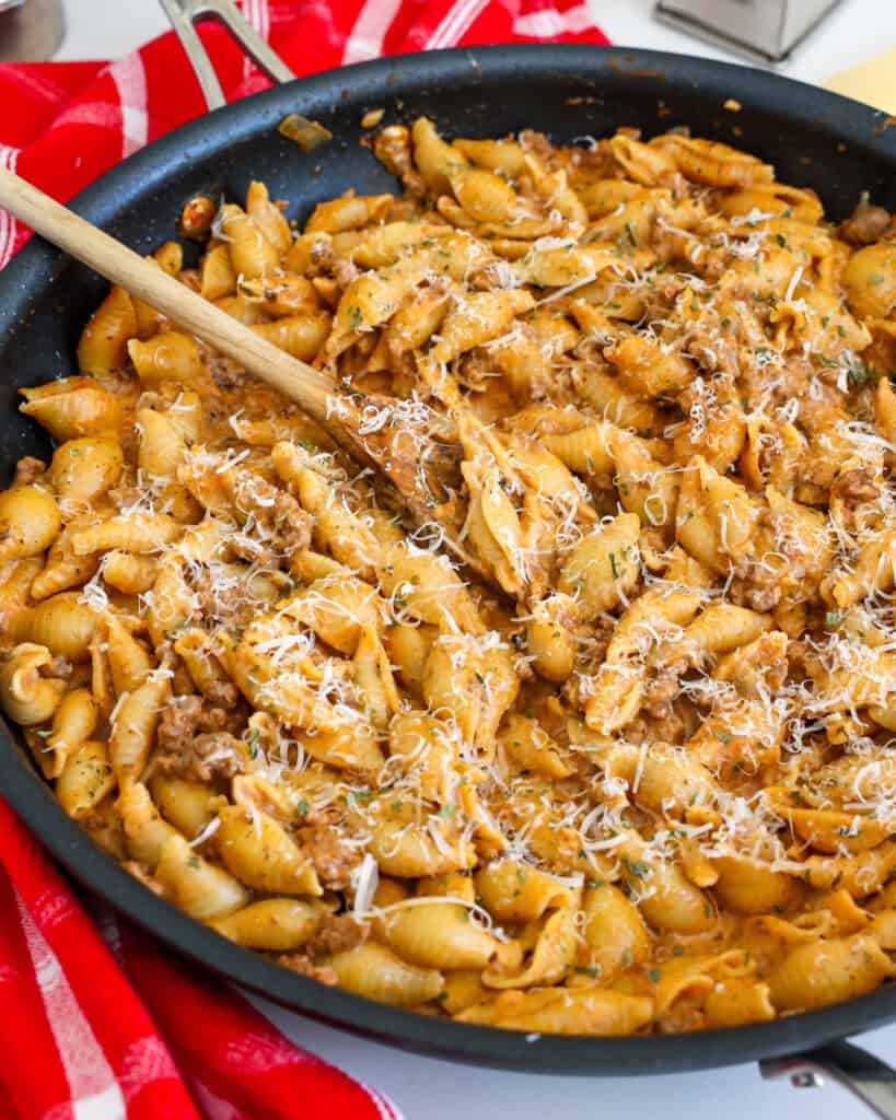 With tender ground beef and hearty shells, this creamy beef and shells recipe is a delicious twist on a classic comfort food dish.