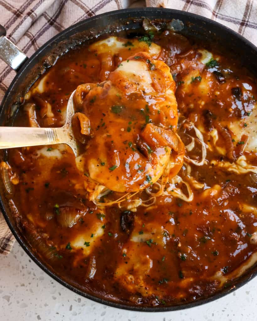 French Onion Chicken is pan-seared chicken cutlets smothered in a rich French Onion gravy and topped with Parmesan, Swiss, and fresh parsley. If you love slow-cooked caramelized onions, chicken, and French Onion Soup, then this is a must-try. 