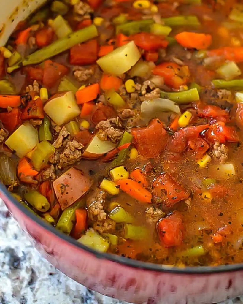 Hamburger Soup is the perfect blend of ground beef and fresh garden veggies like tomatoes, onions, carrots, and green beans.