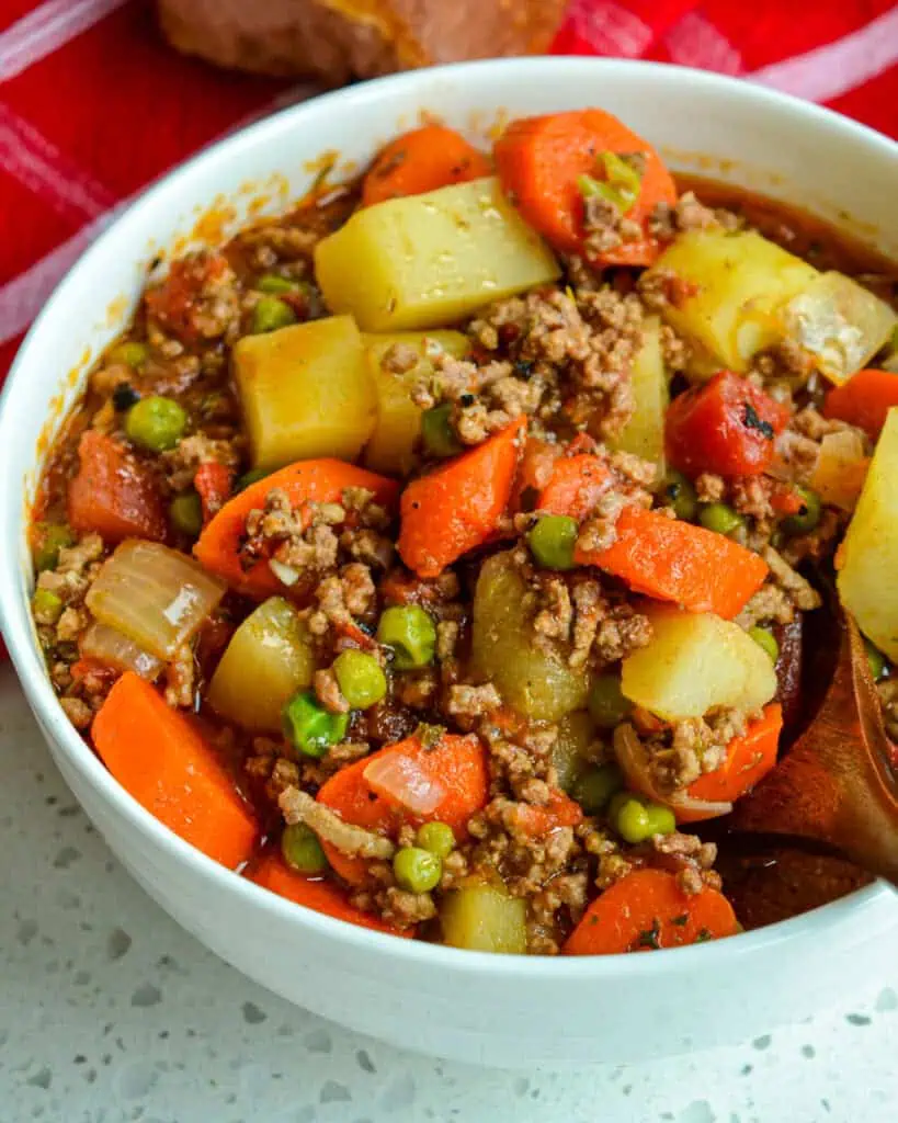 A bowl full of hamburger stew. 