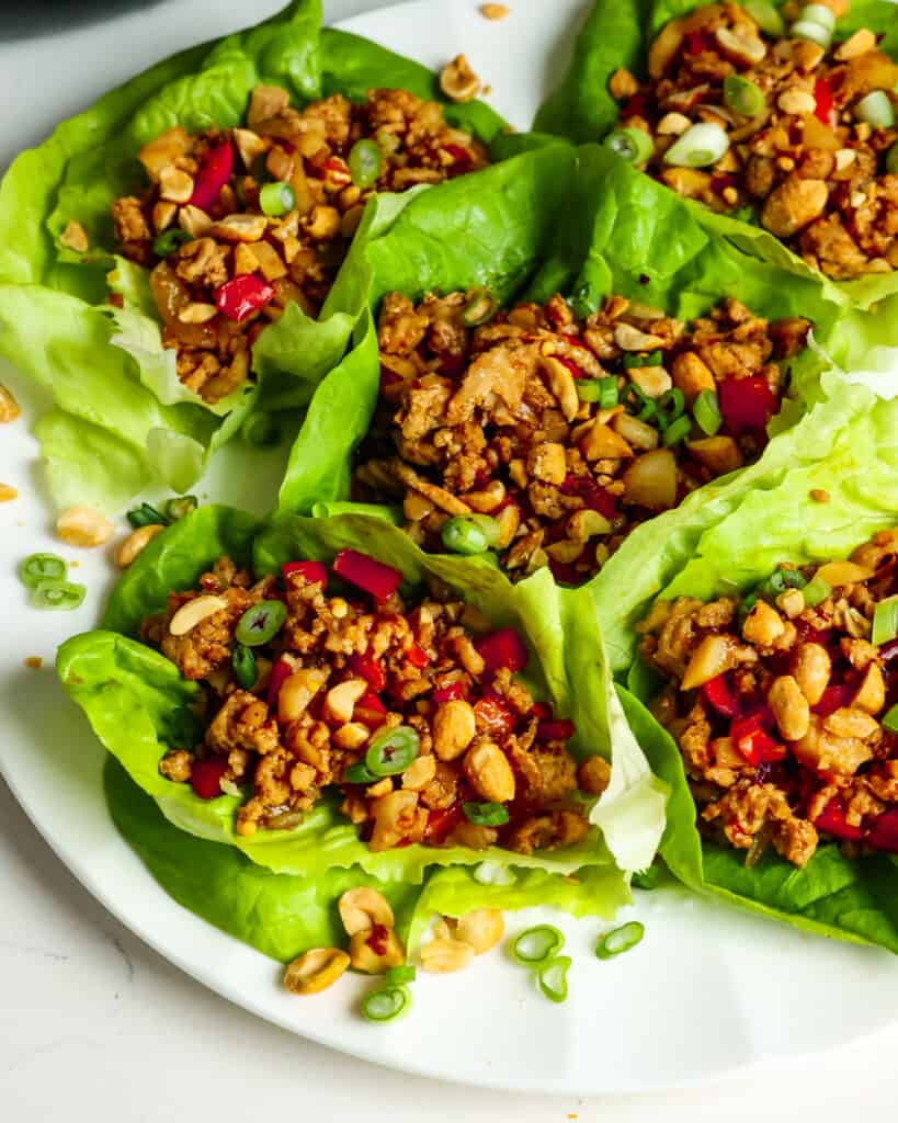 Chicken lettuce wraps are packed with plenty of protein from ground chicken and fresh vegetables like onion, red pepper, garlic, water chestnuts, and butter lettuce.
