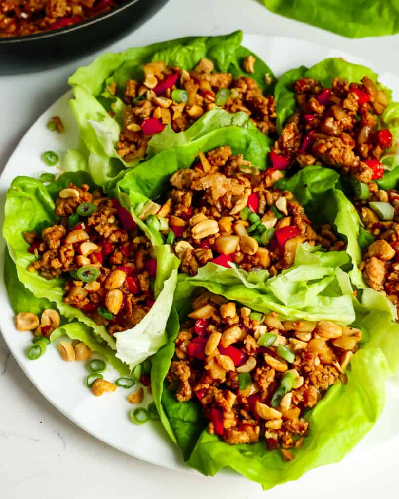 Lettuce Wraps (A Flavor Packed Quick and Easy Dinner Experience) An overhead view of chicken lettuce wraps on a serving platter.