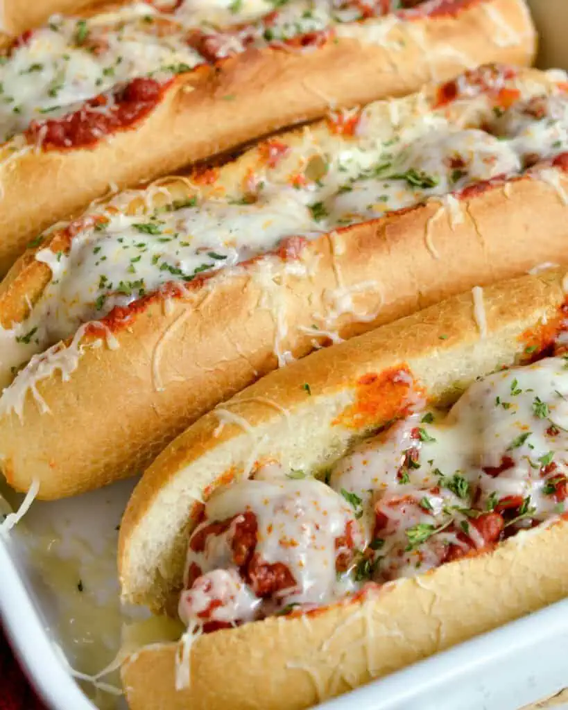 Italian Meatball Subs combine homemade meatballs with pasta sauce and melted mozzarella all on buttered toasted sub rolls.