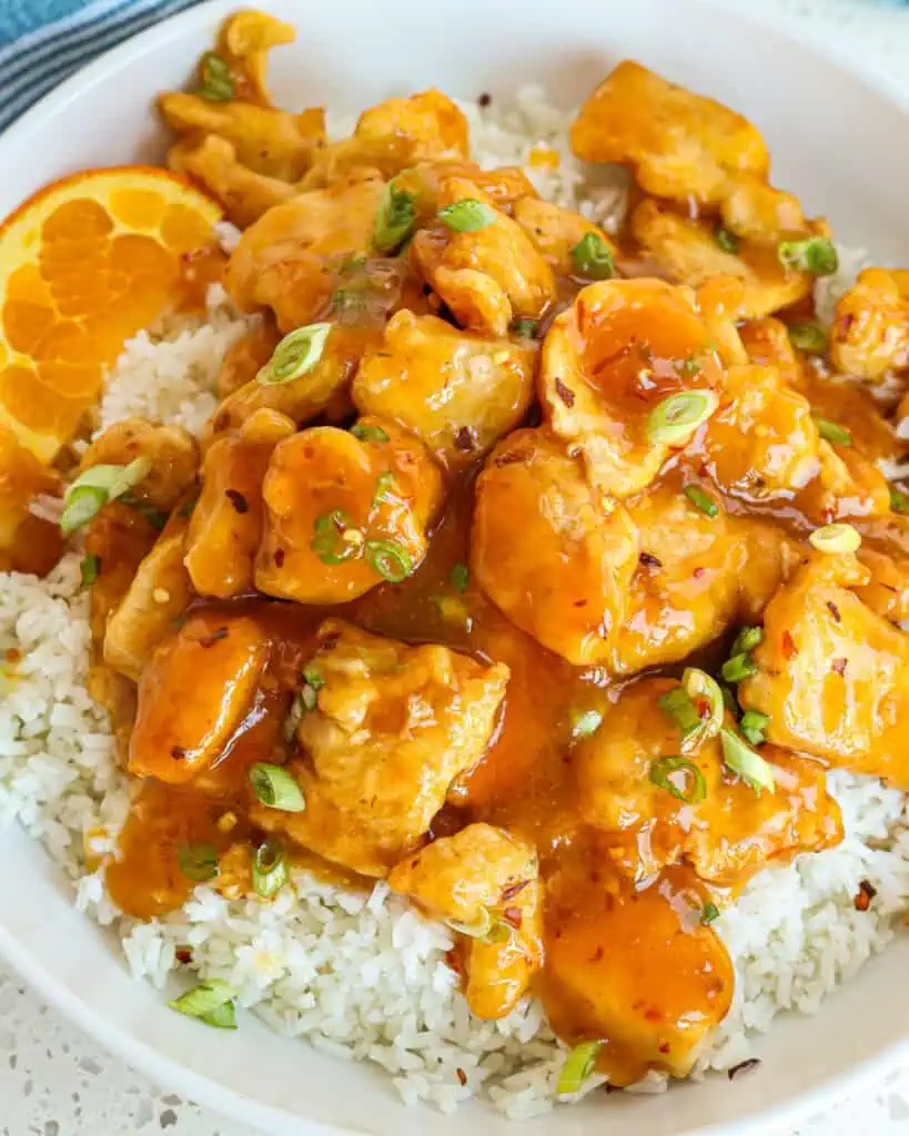 This easy and delectable Orange Chicken Recipe combines lightly battered crispy fried pieces of chicken in a sweet and spicy tangy orange sauce.
