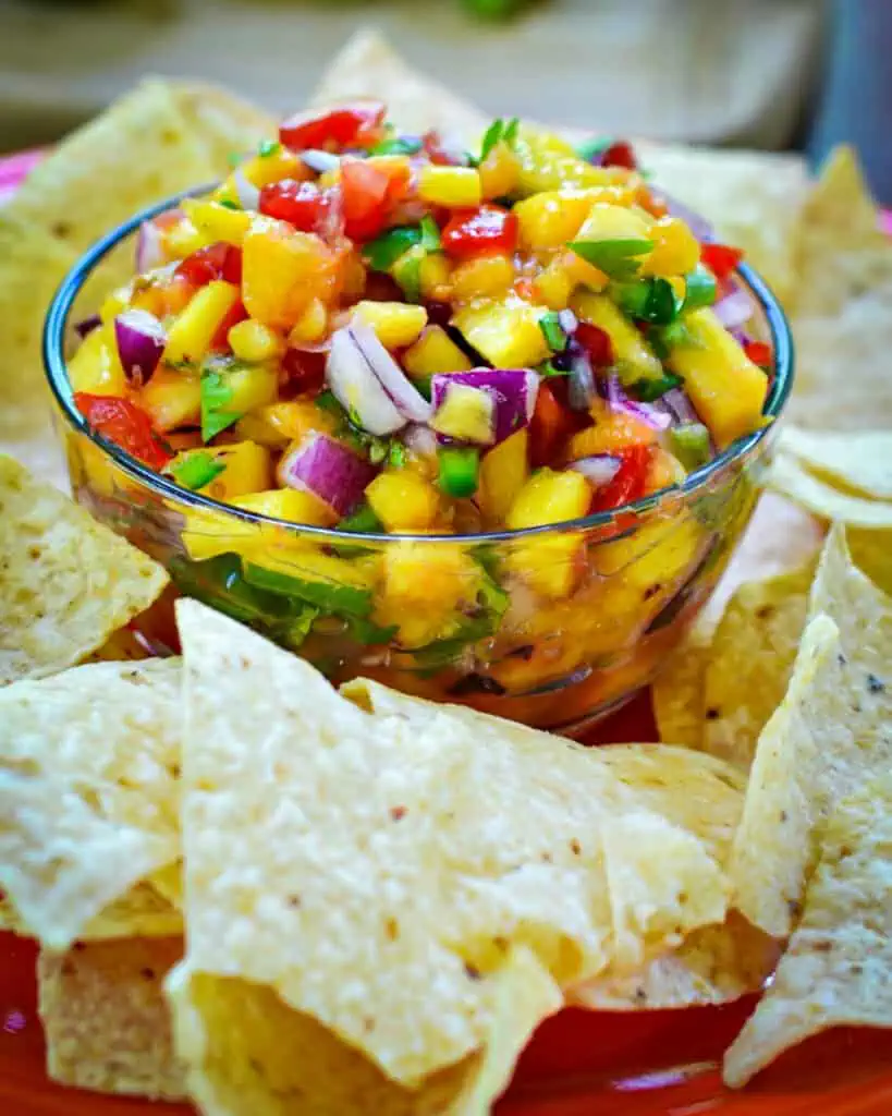 This ten minute Fresh Peach Salsa takes fresh peaches, sweet tomatoes and spicy jalapenos to a whole new taste tantalizing level.