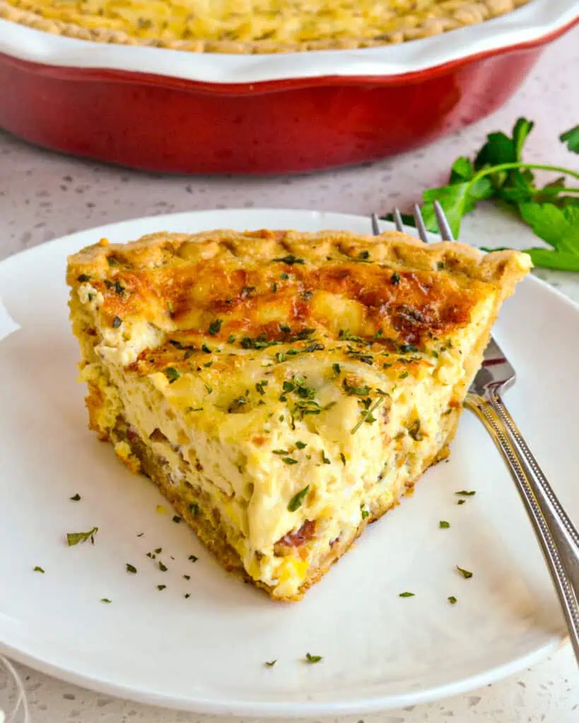 This scrumptious classic Quiche Lorraine is loaded with crispy bacon, gruyere cheese, and sweet sauteed onions, all nestled in a savory custard that is baked to golden perfection.