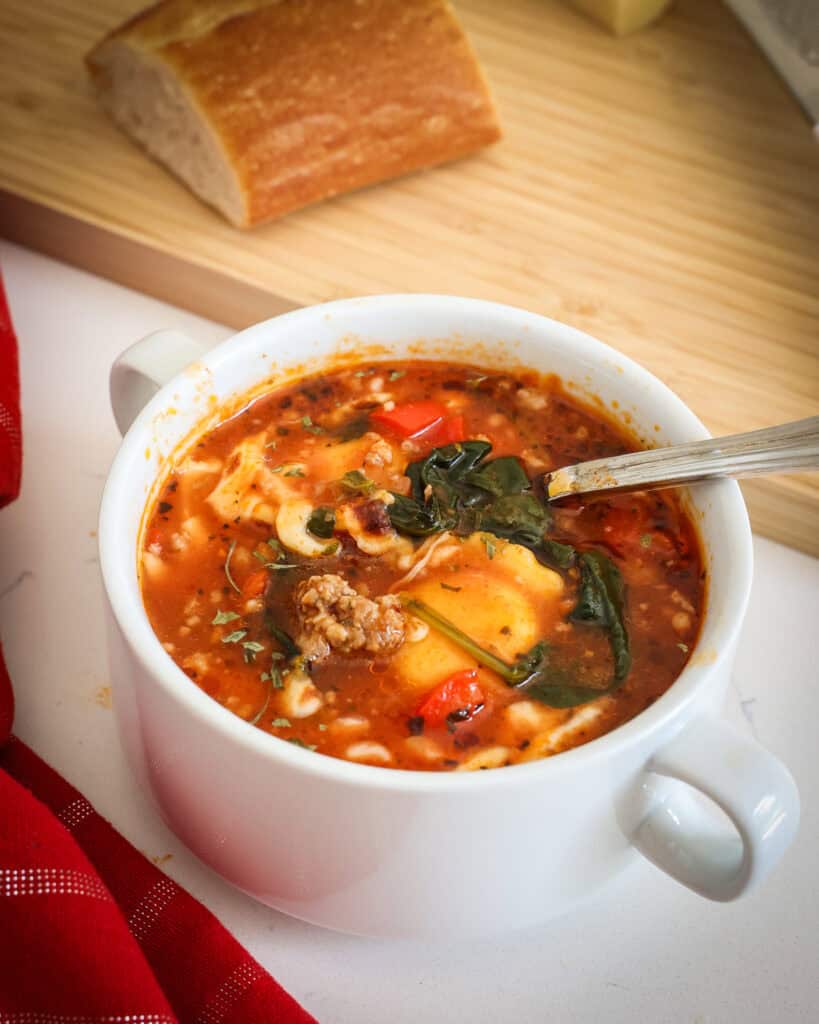 This tasty ravioli soup combines pork sausage, onion, sweet red bell pepper, spinach, and cheese ravioli in a tasty beef and tomato broth. 