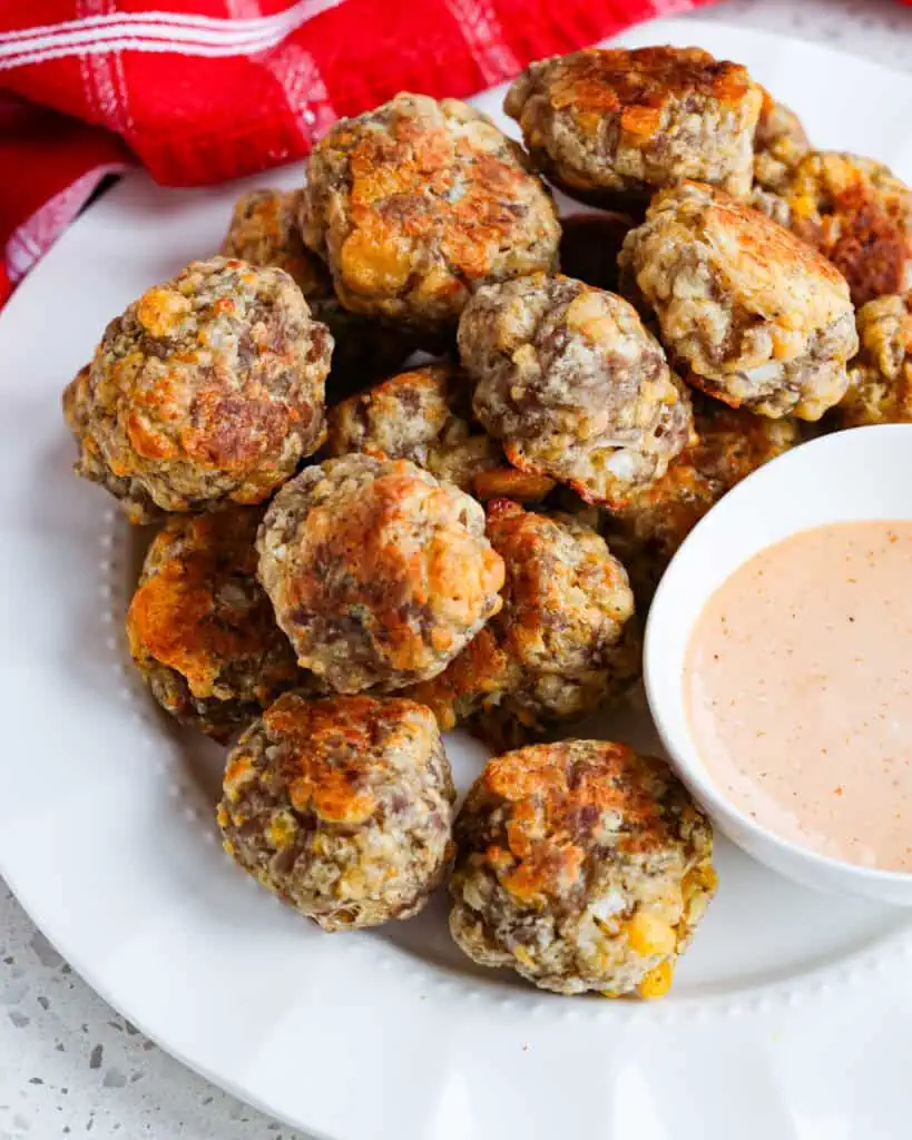 With just eight simple ingredients, these sausage balls are ready for the oven in about fifteen minutes. 