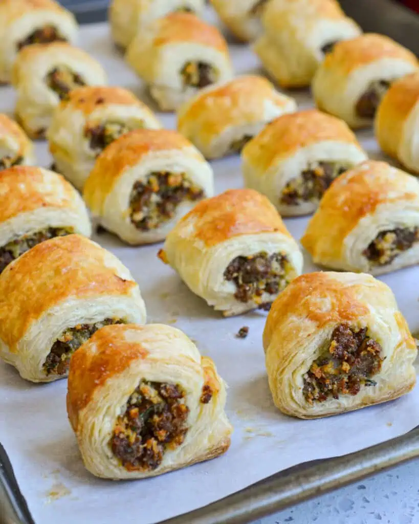 These amazing Sausage Rolls are made easy using ready to bake frozen puff pastry