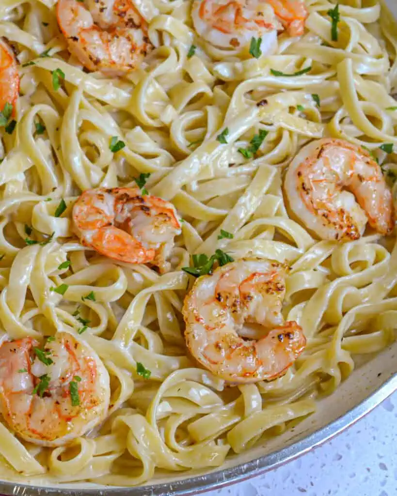 Shrimp Fettuccine Alfredso is a perfect company-worthy shrimp pasta dish that is quick enough to make for a weeknight dinner.