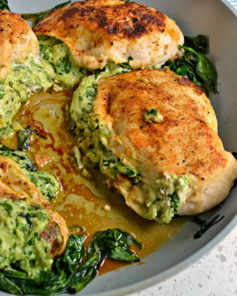 This Spinach Stuffed Chicken is a delicious combination of chopped spinach, herb cream cheese, mozzarella, and Parmesan. 