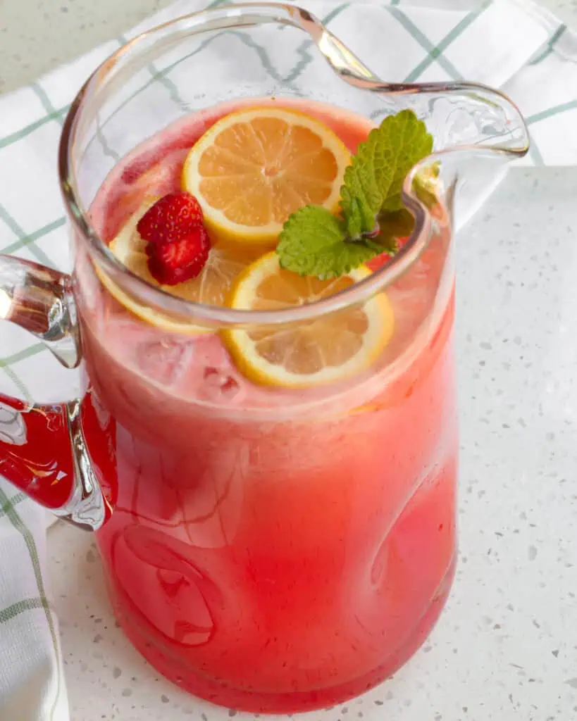 With just a handful of ingredients and a few minutes, this refreshing Strawberry Lemonade made with fresh strawberries and lemons is perfect for all your summer entertaining needs.  