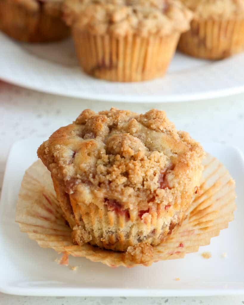 Bring spring in early with these homemade bakery-style strawberry muffins made with fresh strawberries, cinnamon, buttermilk, vanilla, and a streusel crumb topping.