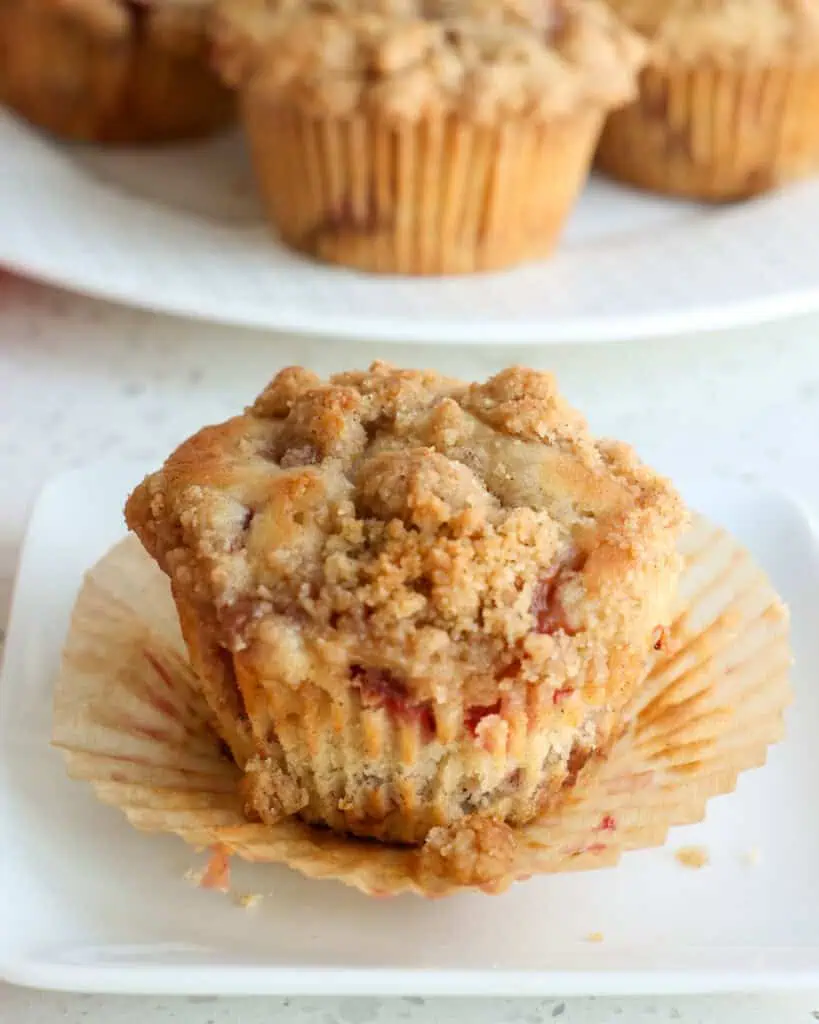 Bring spring in early with these homemade bakery-style strawberry muffins made with fresh strawberries, cinnamon, buttermilk, vanilla, and a streusel crumb topping. 