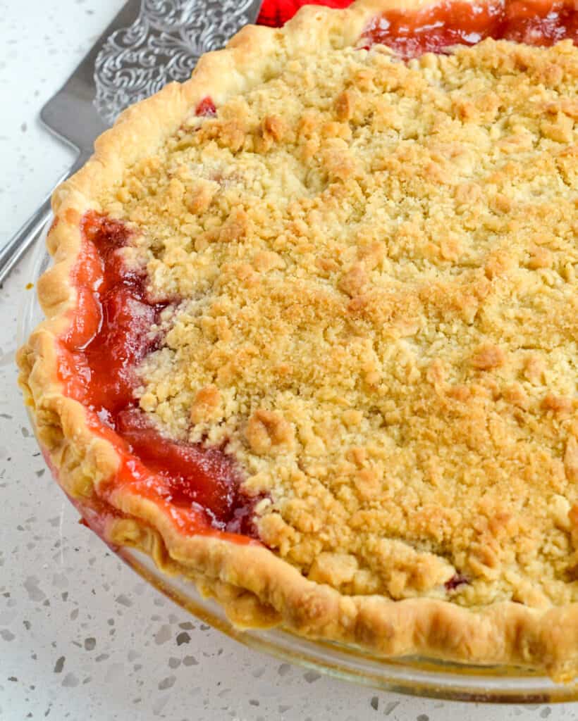 Fresh pie made with rhubarb and strawberries in a buttery flaky homemade pie crust. 