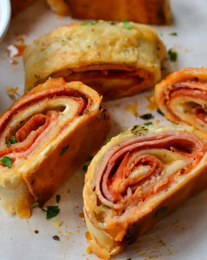 This delectable pepperoni and mozzarella  Stromboli Recipe comes together quickly with an easy made from scratch dough.  It is so good that it will quickly become one of your favorite recipes.