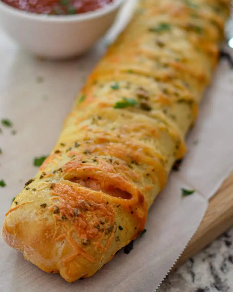 Cut slits in the top diagonally every 1-1 1/2 inches and bake for about 25 minutes in a preheated oven. 