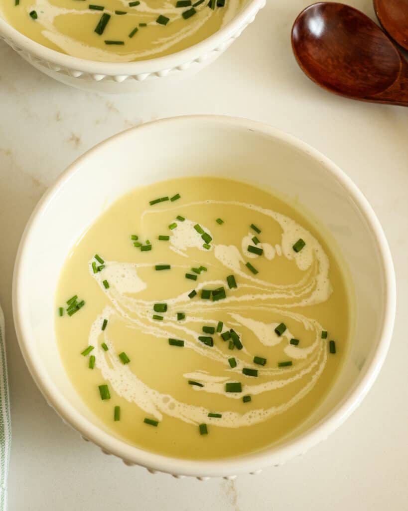 Try this classic vichyssoise recipe with potatoes, leeks, and cream. It's a flavorful and velvety soup that can be served hot or cold. 
