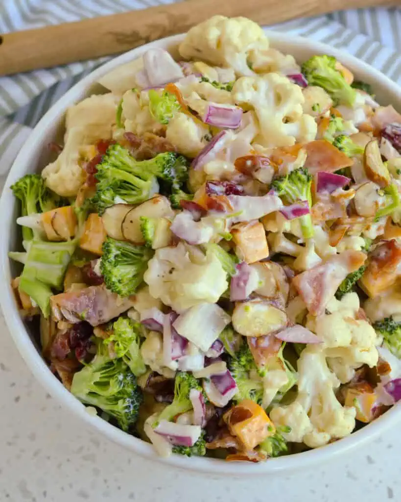 Broccoli and cauliflower salad with cheddar, almonds, and red onion. 