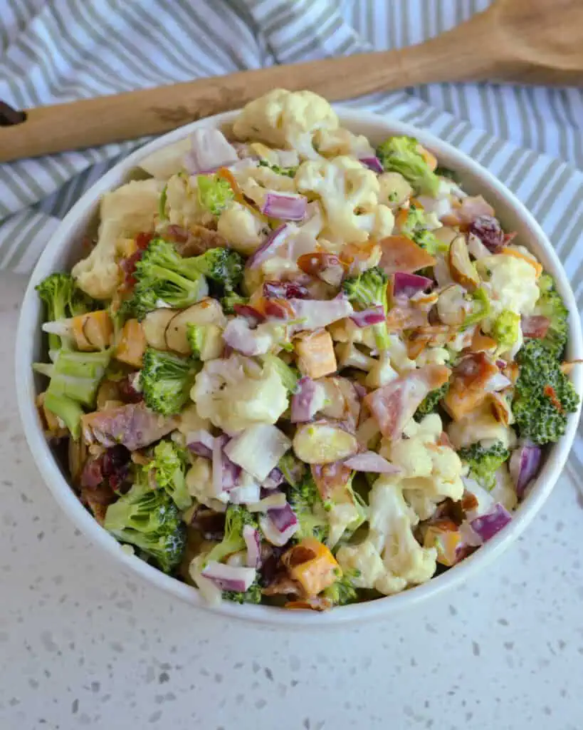 Broccoli, cauliflower, almonds, red onion, cheddar cheese, and bacon in a creamy dressing. 