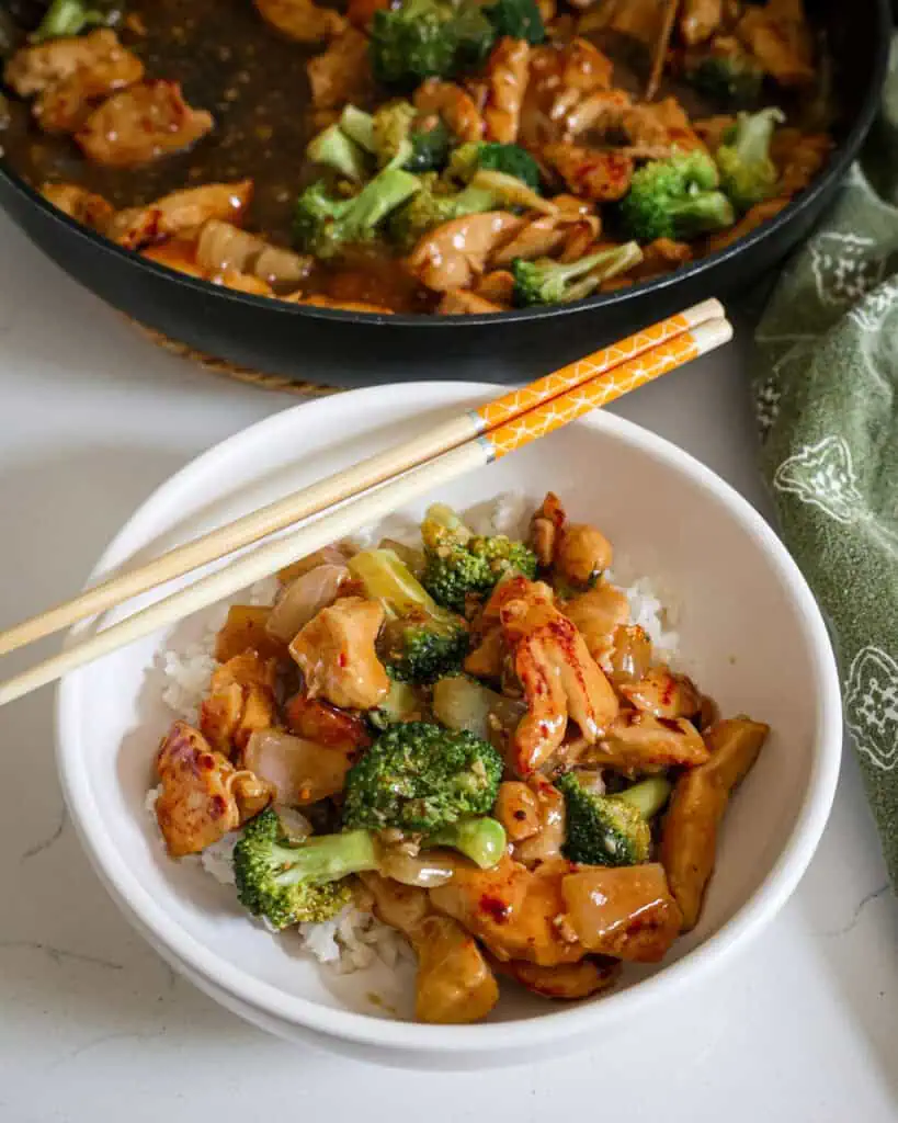Stir fried chicken and broccoli in a small bowl. 
