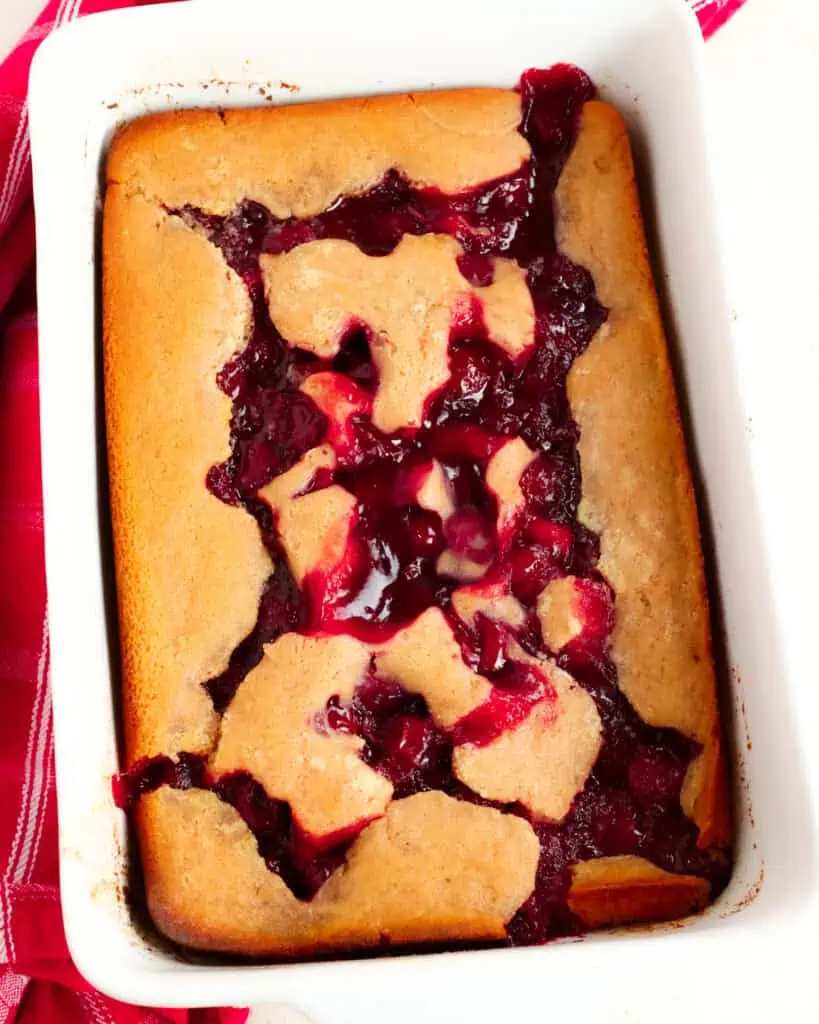 A baked cherry cobbler in a 9x13 inch pan