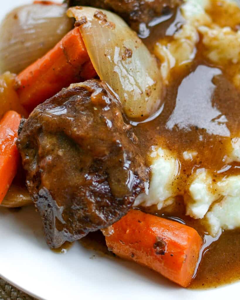 Beef Short Ribs Recipe Beef short ribs with gravy over mashed potatoes